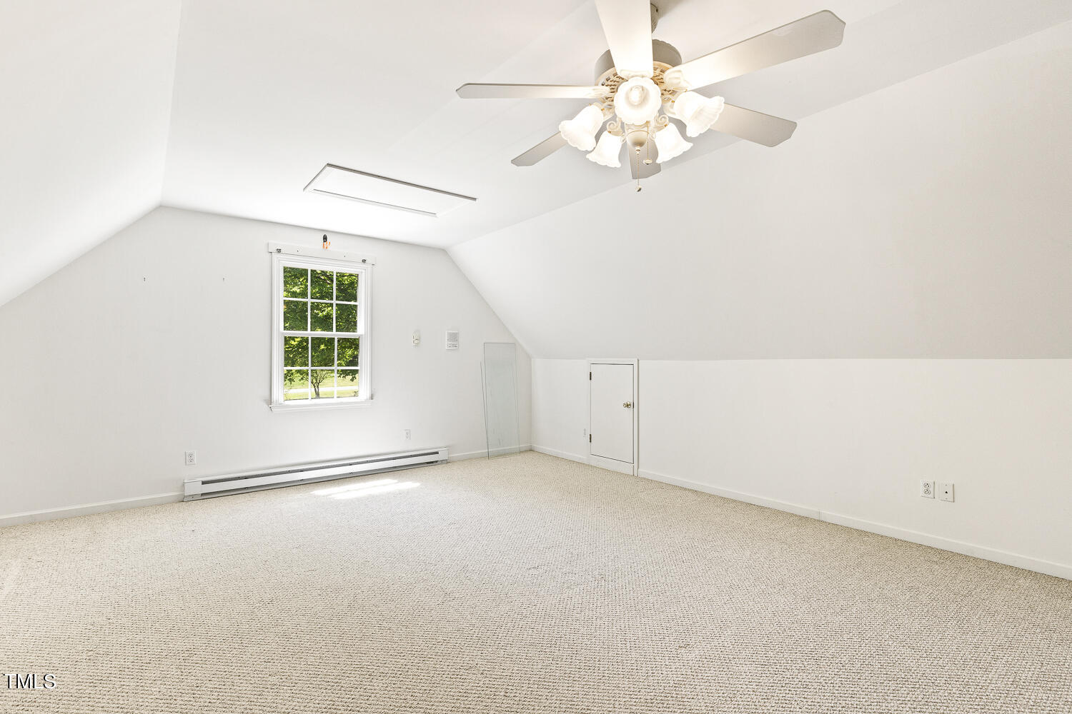 134 Rollins Mill Road Holly Springs, NC 27540 - Photo 23 of 33 an empty room with a chandelier fan and windows