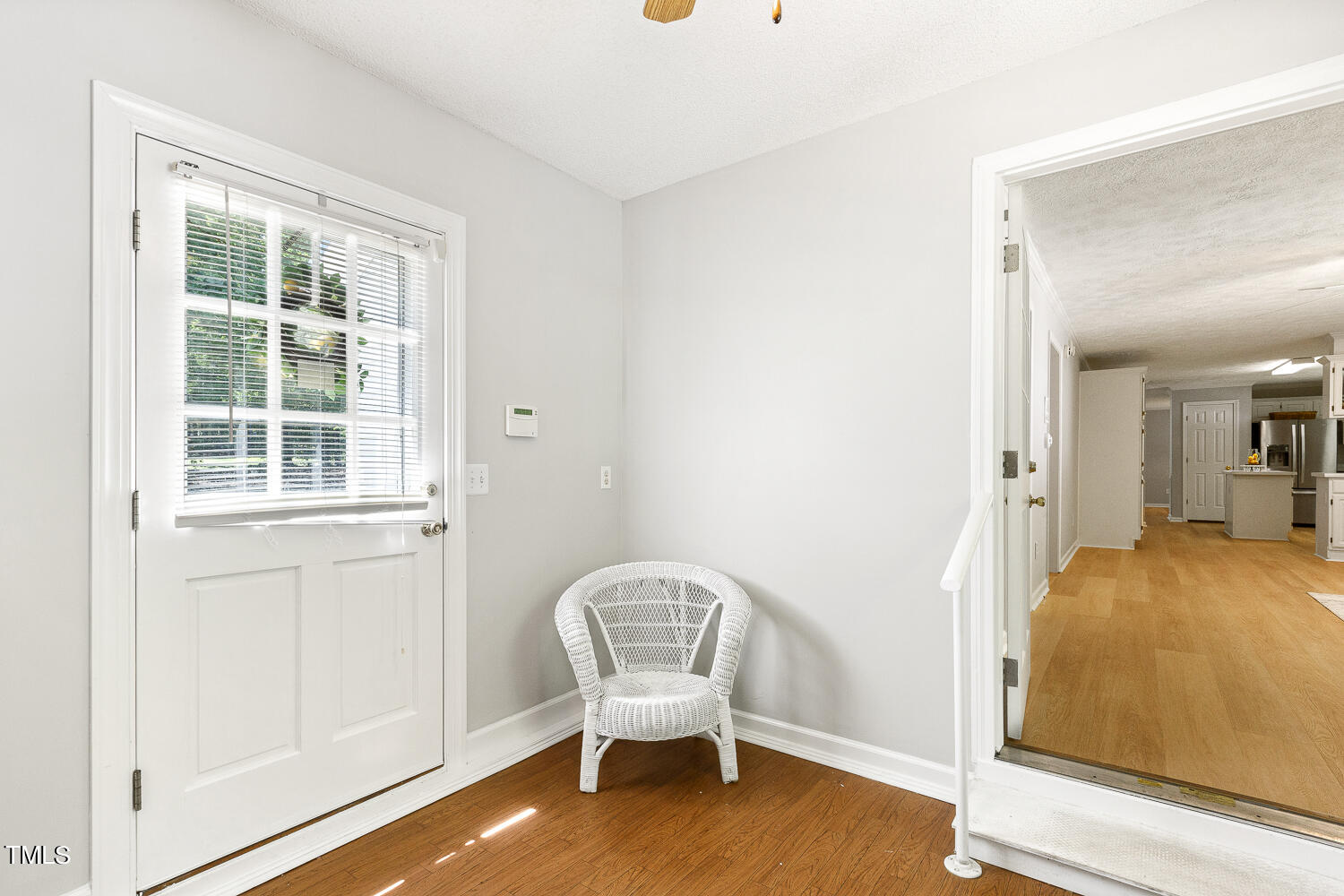 134 Rollins Mill Road Holly Springs, NC 27540 - Photo 24 of 33 a view of a bedroom with wooden floor and windows