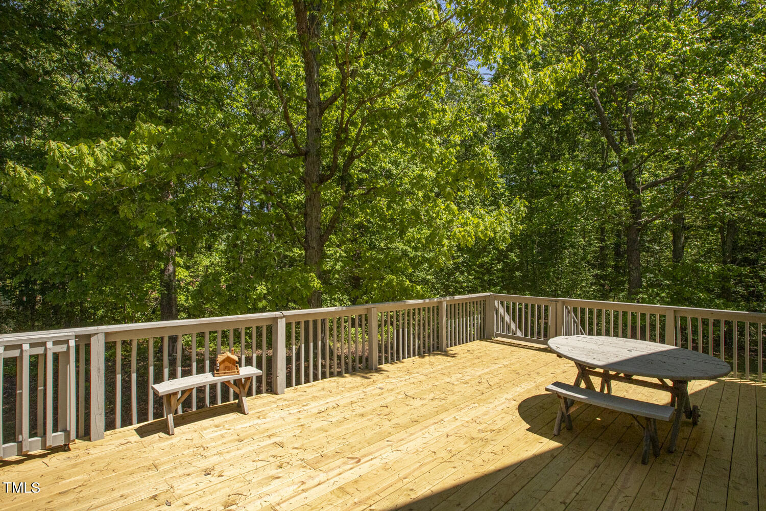 134 Rollins Mill Road Holly Springs, NC 27540 - Photo 26 of 33 a view of a wooden deck with chairs