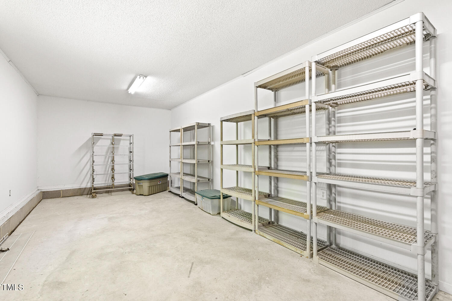 134 Rollins Mill Road Holly Springs, NC 27540 - Photo 29 of 33 a view of an empty room with empty shelves
