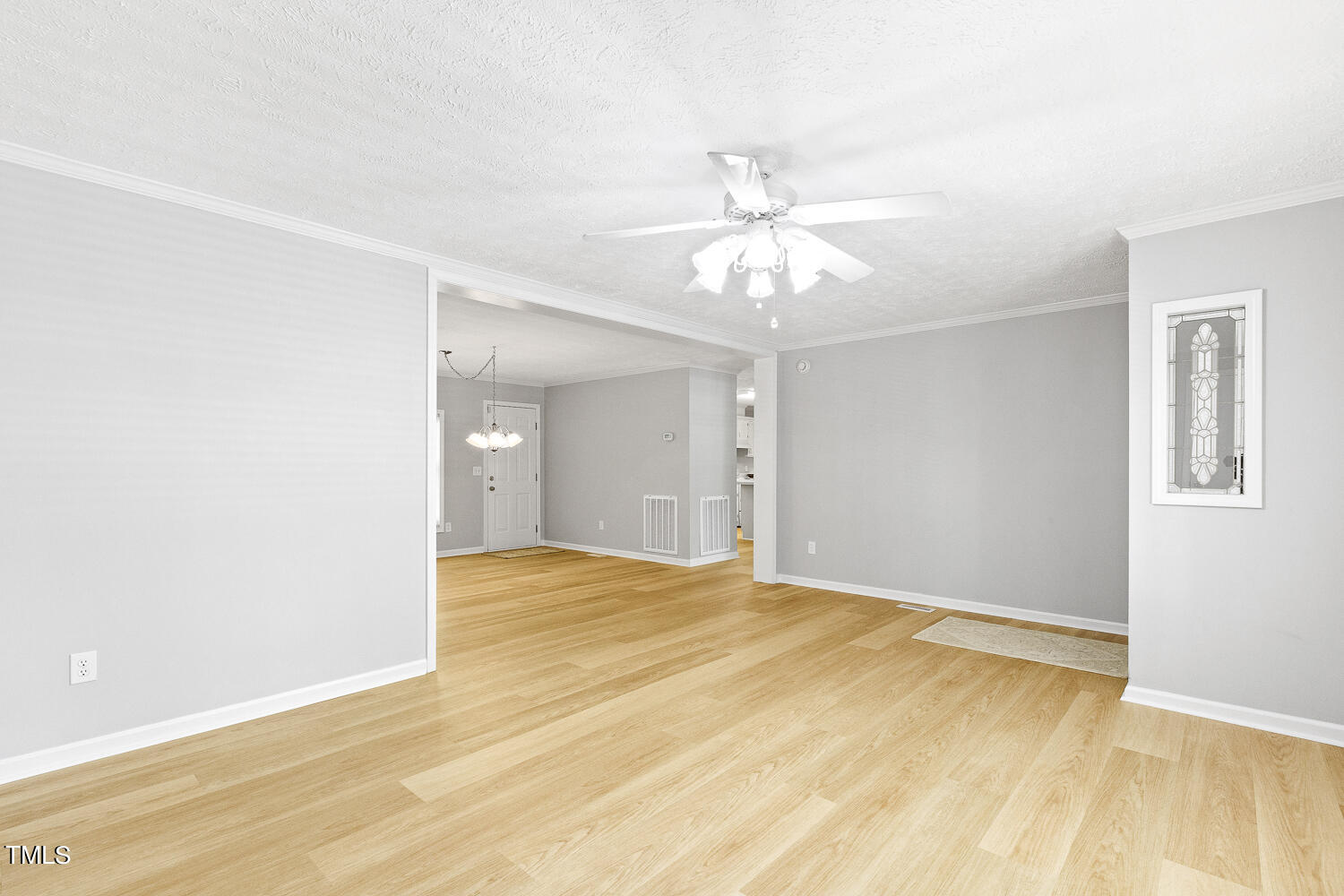 134 Rollins Mill Road Holly Springs, NC 27540 - Photo 9 of 33 a view of an empty room with wooden floor