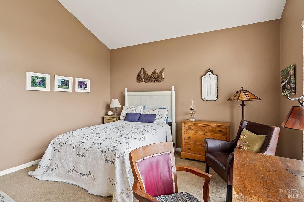 6252 Meadowstone Drive Santa Rosa, CA 95409 - Photo 26 of 33 a bedroom with a bed and wooden floor