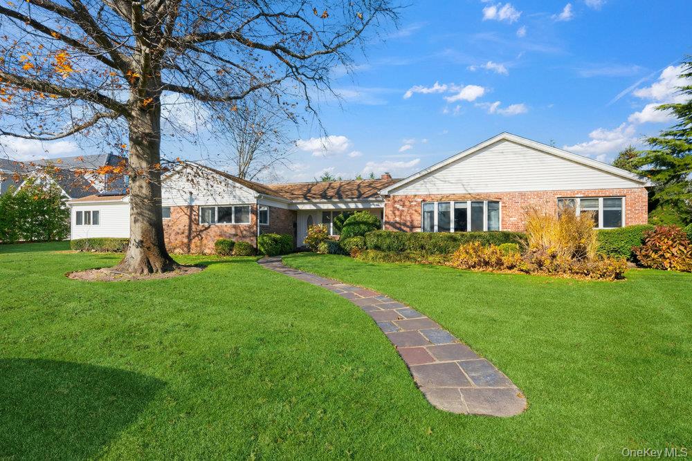 72 Lake End Road Merrick, NY 11566 - Photo 3 of 42 Back of house with a yard and brick siding
