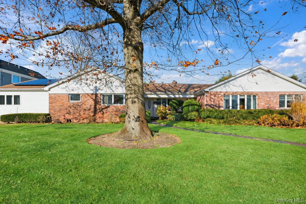 72 Lake End Road Merrick, NY 11566 - Photo 4 of 42 View of front of property with brick siding and a front yard