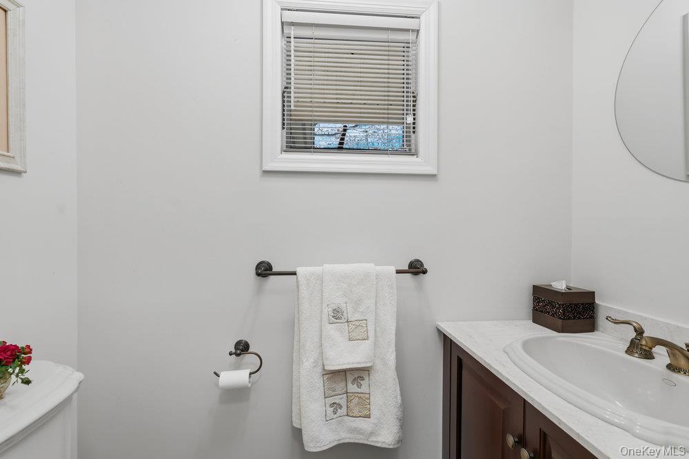 72 Lake End Road Merrick, NY 11566 - Photo 10 of 42 Bathroom featuring vanity and toilet