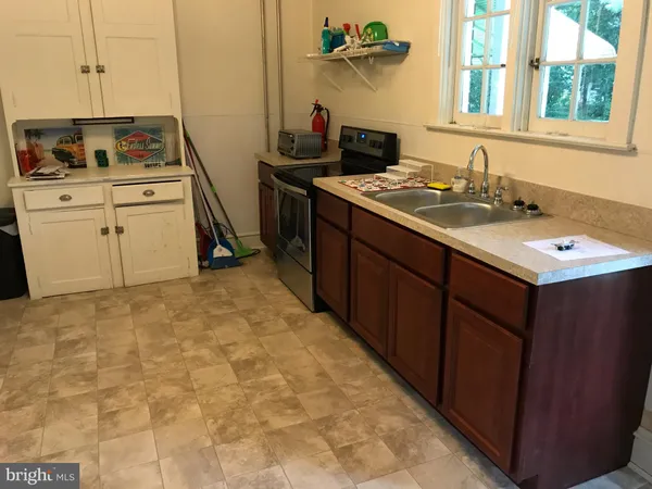 a kitchen with a stove and a sink