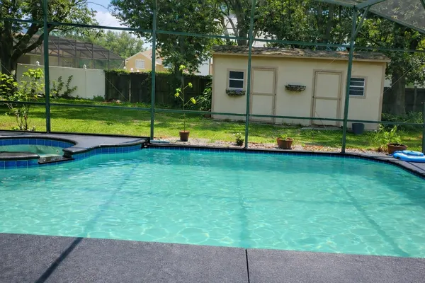 a view of a house with a swimming pool