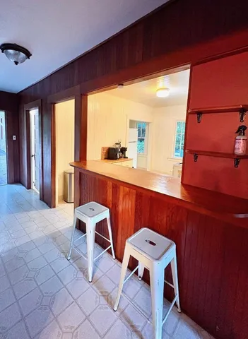 a view of entryway with furniture and large windows