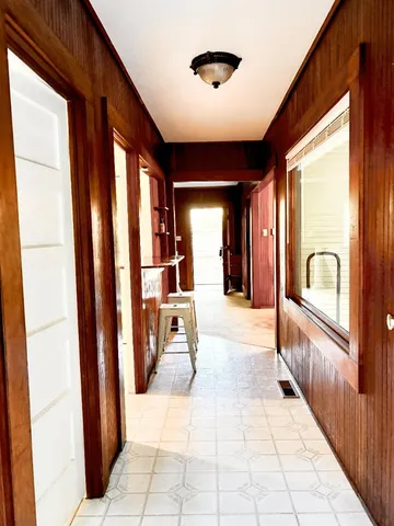 a view of a door and a window