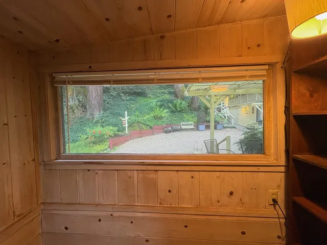 a view of an empty room with a window