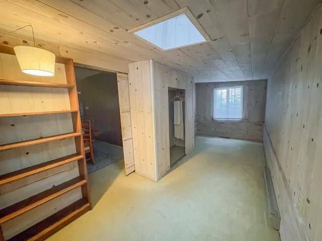 a view of a patio with couches and table and chairs and potted plants