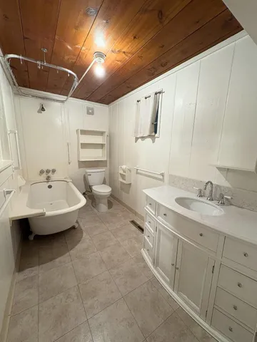 a kitchen with a sink and a refrigerator