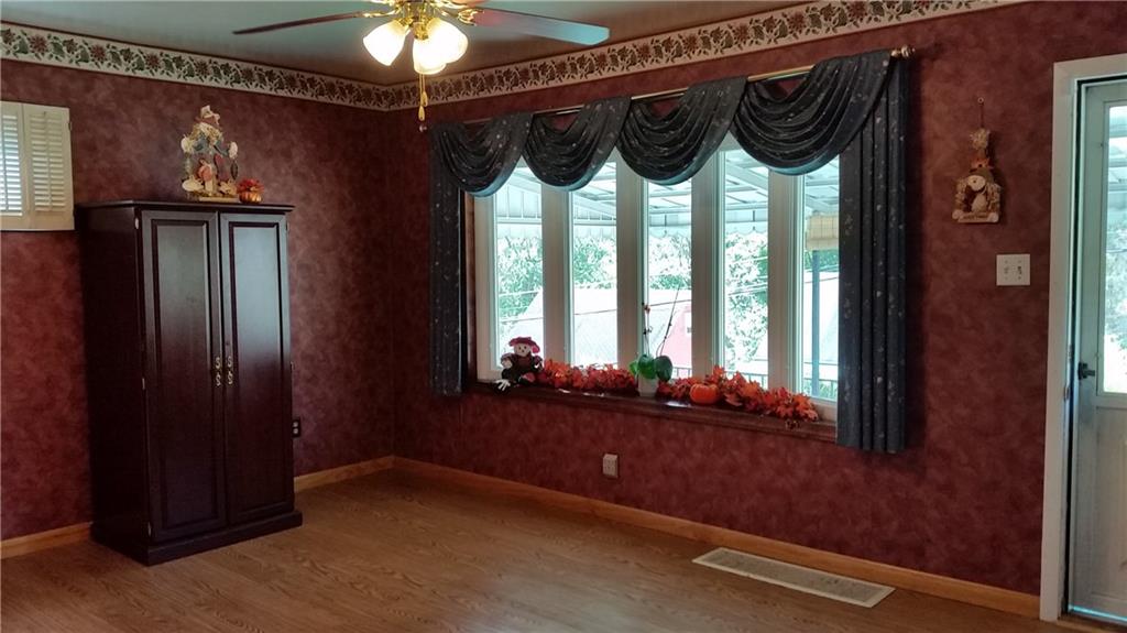 621 Jefferson Road Pittsburgh, PA 15235 - Photo 4 of 25 Beautiful over-sized Bay Window! Ceiling fan and laminent flooring!