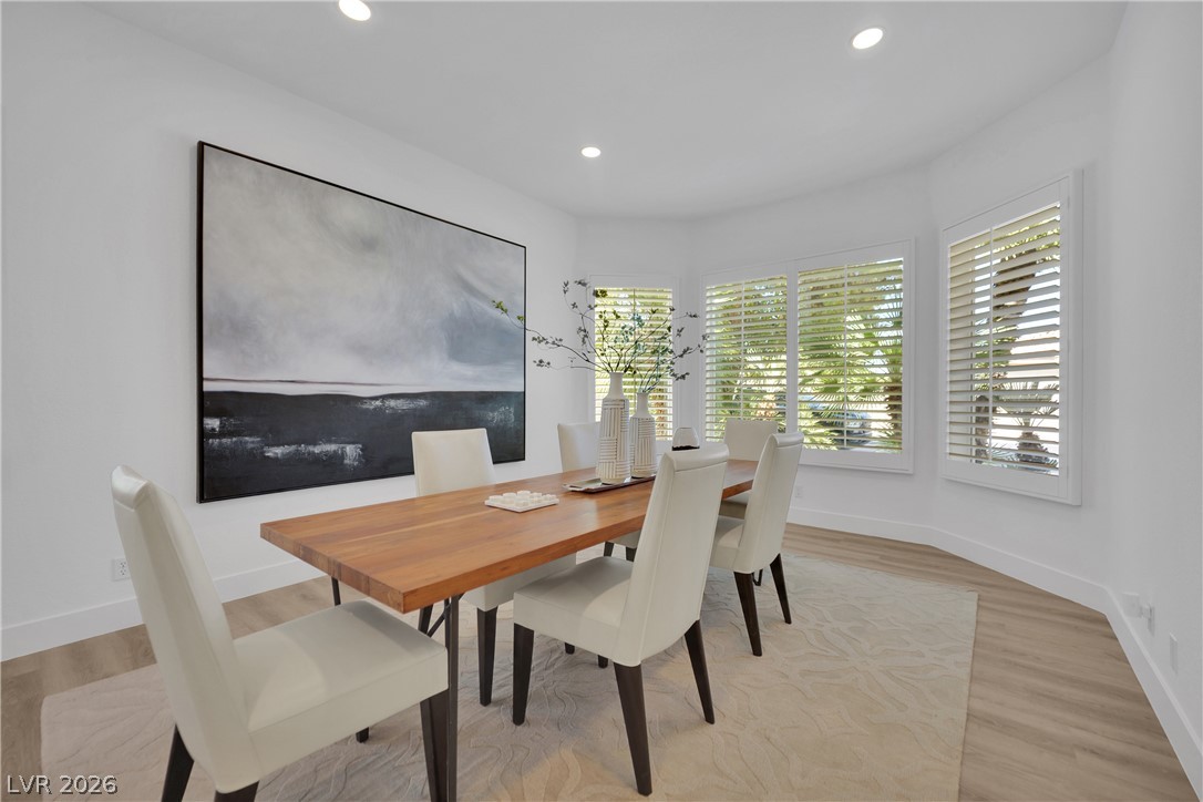 8981 Rivers Edge Drive Las Vegas, NV 89117 - Photo 7 of 69 Sun-filled dining room with wood flooring, recessed lighting, and ample natural light from multiple windows.