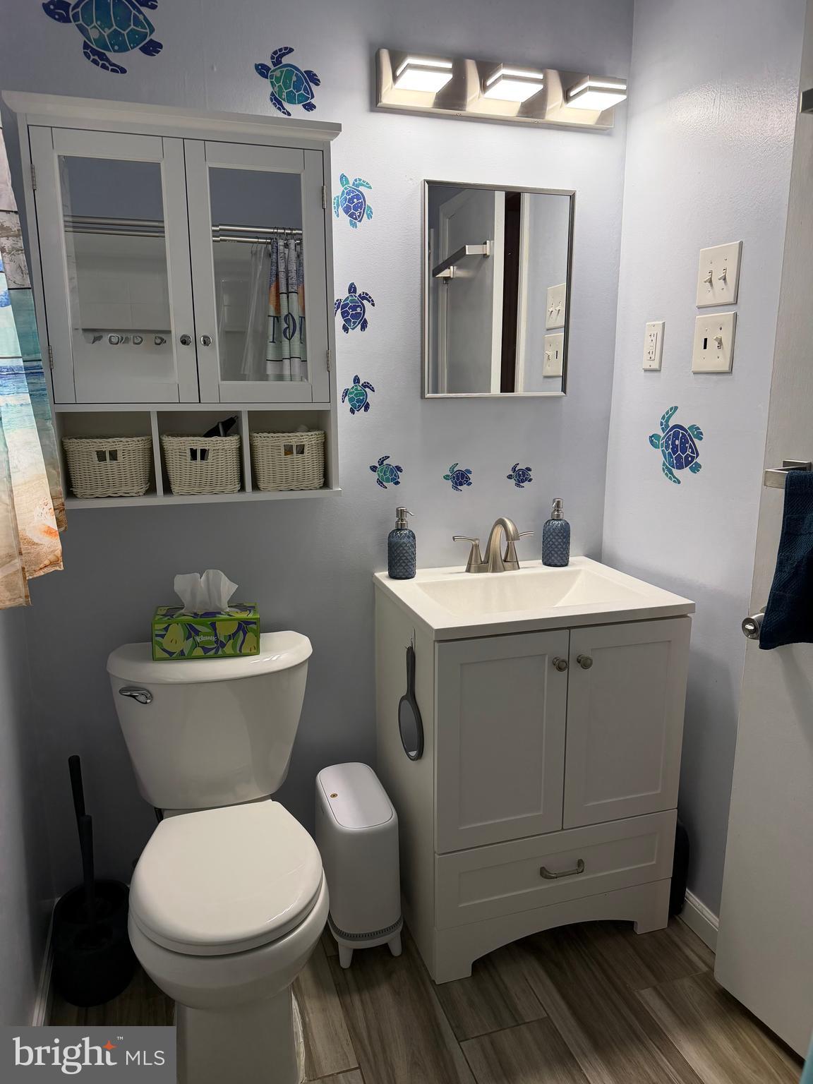 1 Nassau Road Somers Point, NJ 08244 - Photo 27 of 43 a bathroom with a toilet sink and mirror