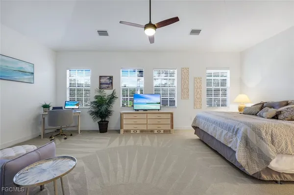 a bedroom with furniture and a window