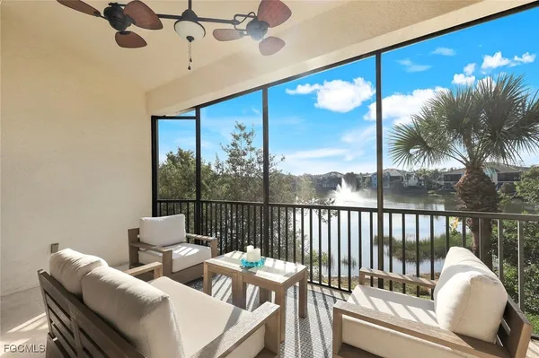 a view of a living room and a balcony