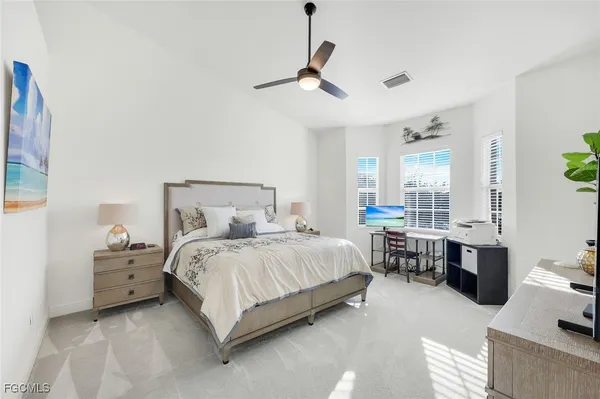 a bed room with a bed and a table