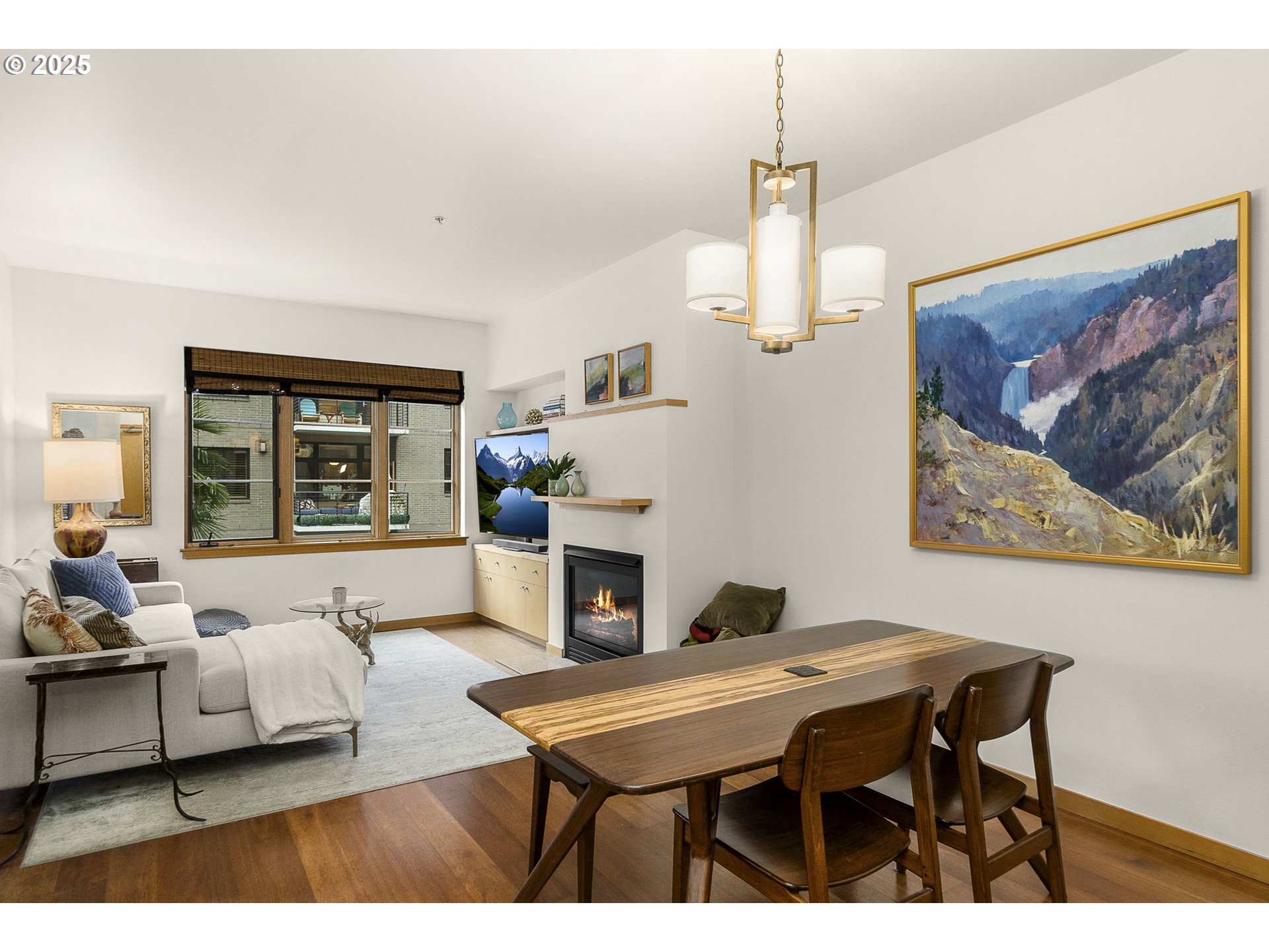 725 Northwest 10th Avenue, Unit 305 Portland, OR 97209 - Photo 15 of 35 a living room with furniture a table and kitchen chandelier