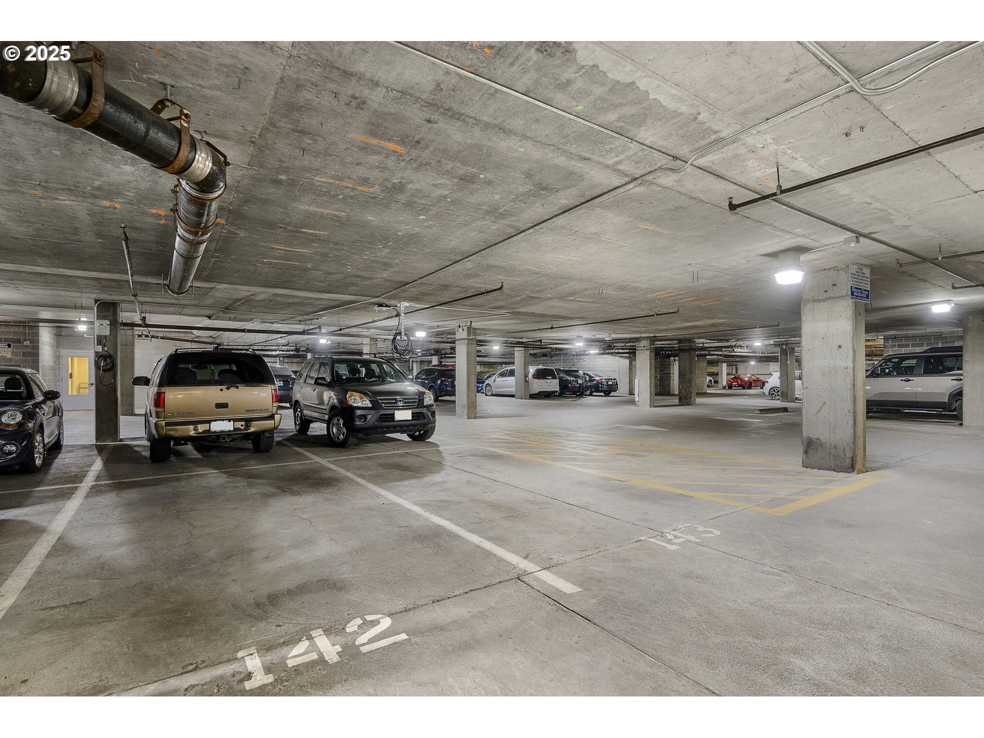 725 Northwest 10th Avenue, Unit 305 Portland, OR 97209 - Photo 30 of 35 a view of parking garage with cars