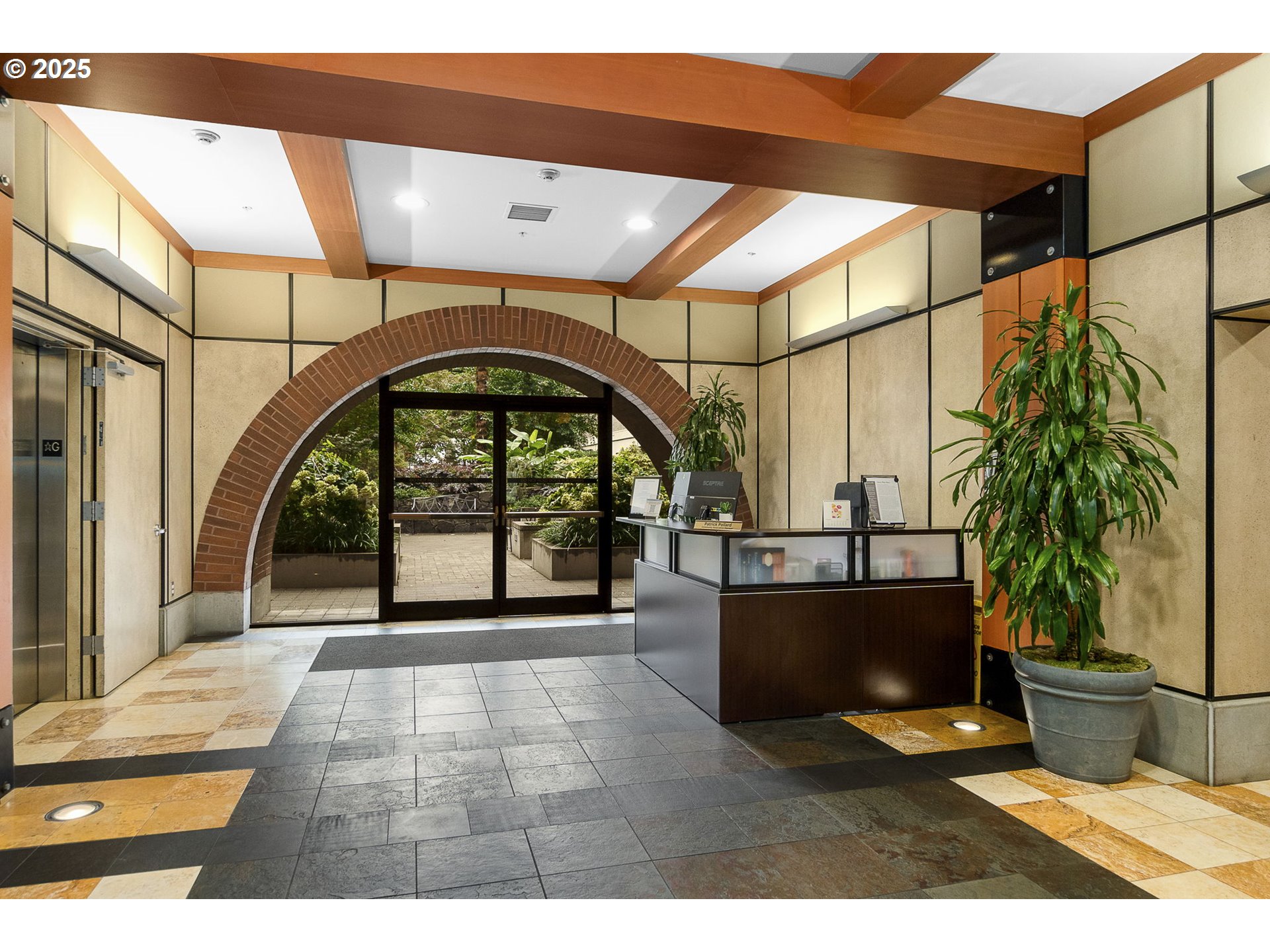 725 Northwest 10th Avenue, Unit 305 Portland, OR 97209 - Photo 6 of 35 a view of entryway with a floor to ceiling window and potted plants