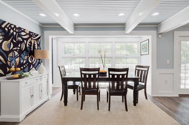 a bedroom with a bed a dresser and book shelf