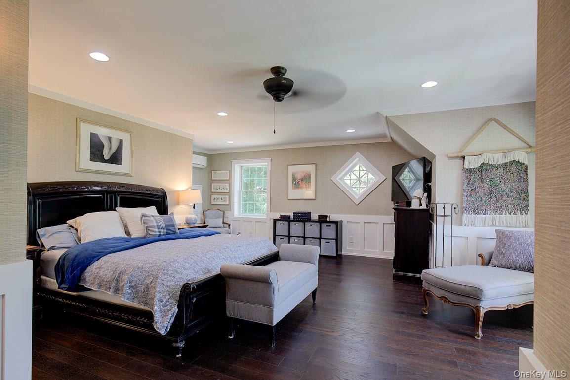 2 Spring Hollow Road Centerport, NY 11721 - Photo 13 of 49 Bedroom with dark wood-type flooring, ornamental molding, wainscoting, and recessed lighting