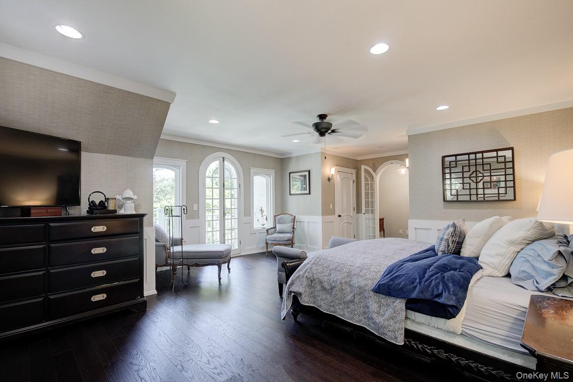 2 Spring Hollow Road Centerport, NY 11721 - Photo 14 of 49 a bedroom with a bed window and a flat screen television