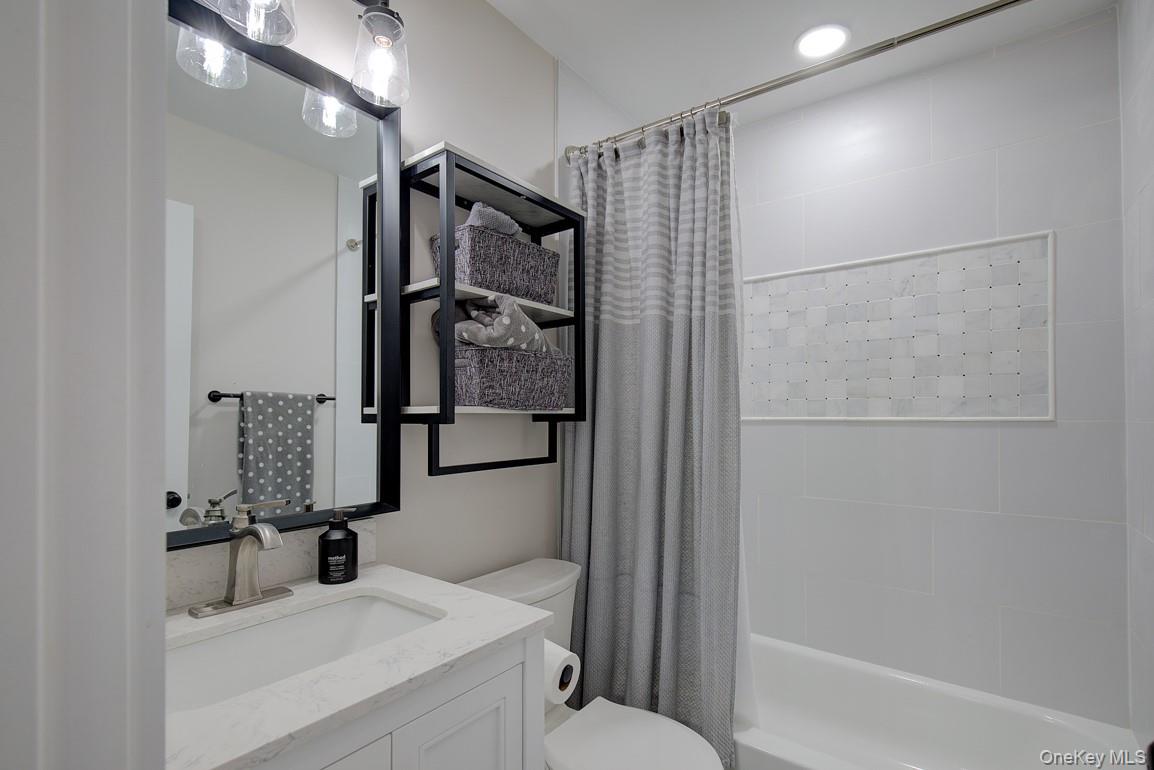 2 Spring Hollow Road Centerport, NY 11721 - Photo 24 of 49 Bathroom with shower / bath combo and vanity