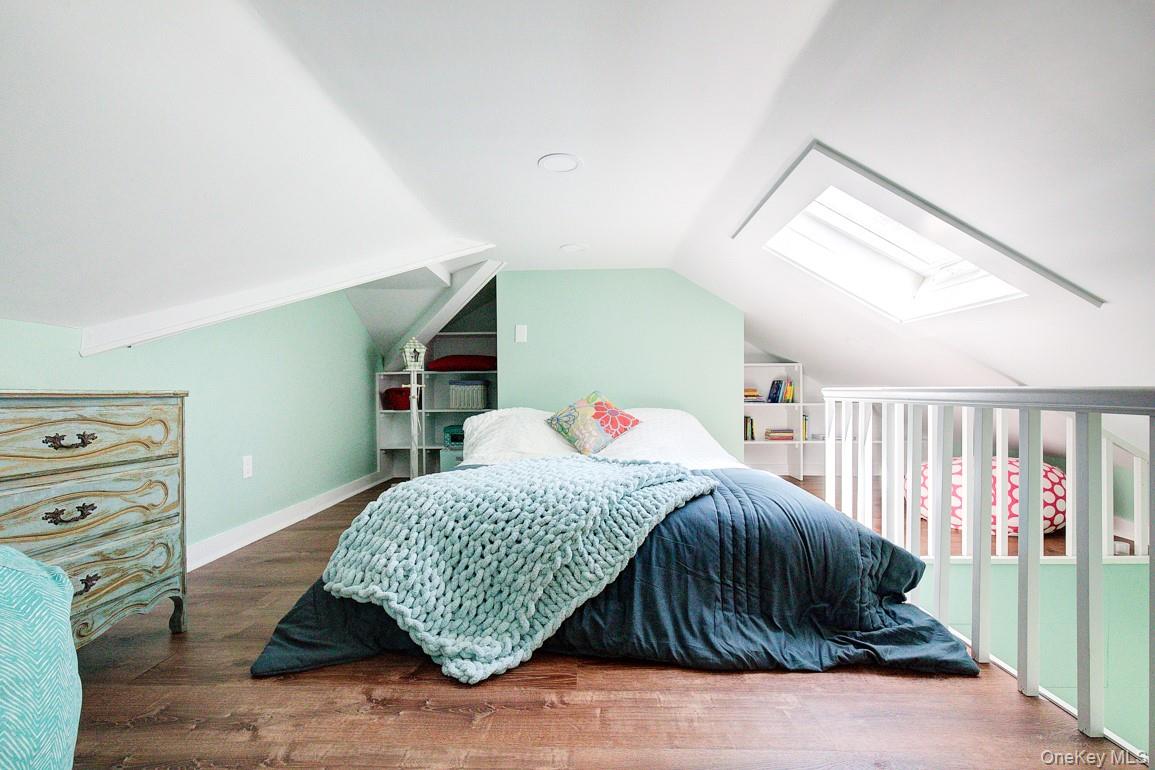 2 Spring Hollow Road Centerport, NY 11721 - Photo 26 of 49 a bedroom with a bed a dresser and book shelf