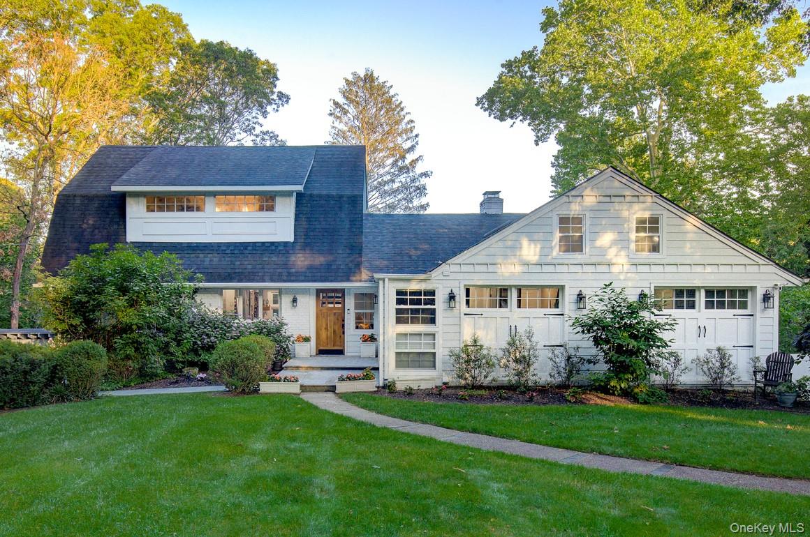 2 Spring Hollow Road Centerport, NY 11721 - Photo 3 of 49 View of front facade with a chimney, a front lawn, and a shingled roof