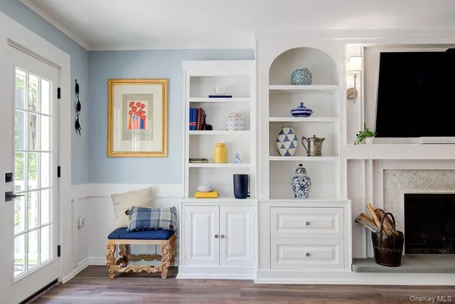a bedroom with furniture and a window