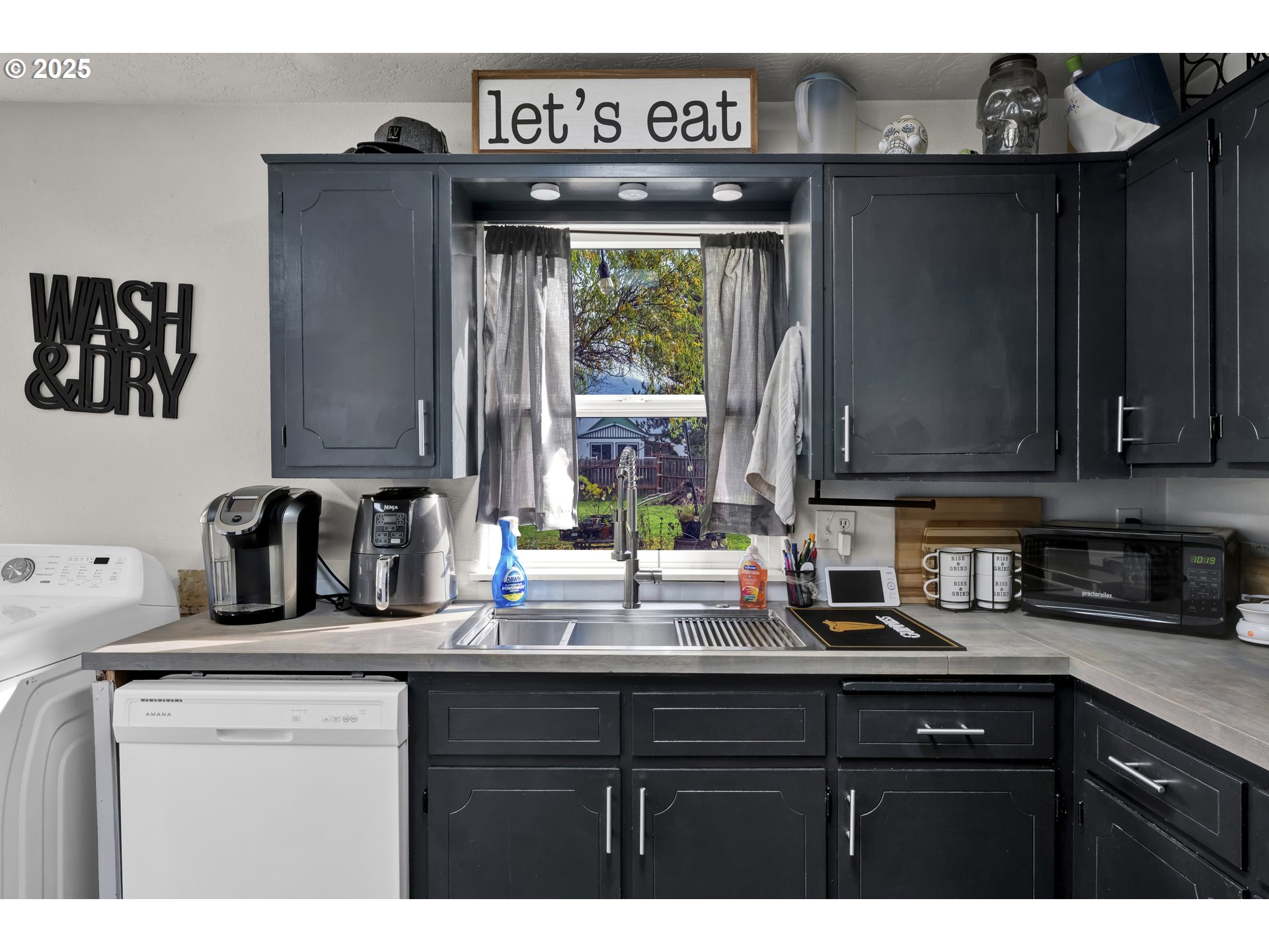 422 Elder Street Drain, OR 97435 - Photo 13 of 41 a kitchen with sink a window and cabinets