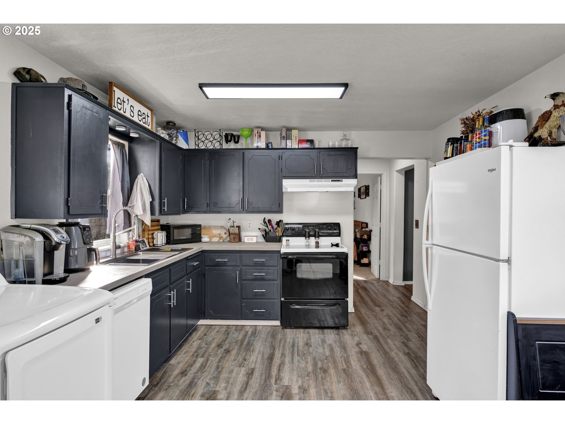 422 Elder Street Drain, OR 97435 - Photo 16 of 41 a kitchen with a refrigerator and a sink
