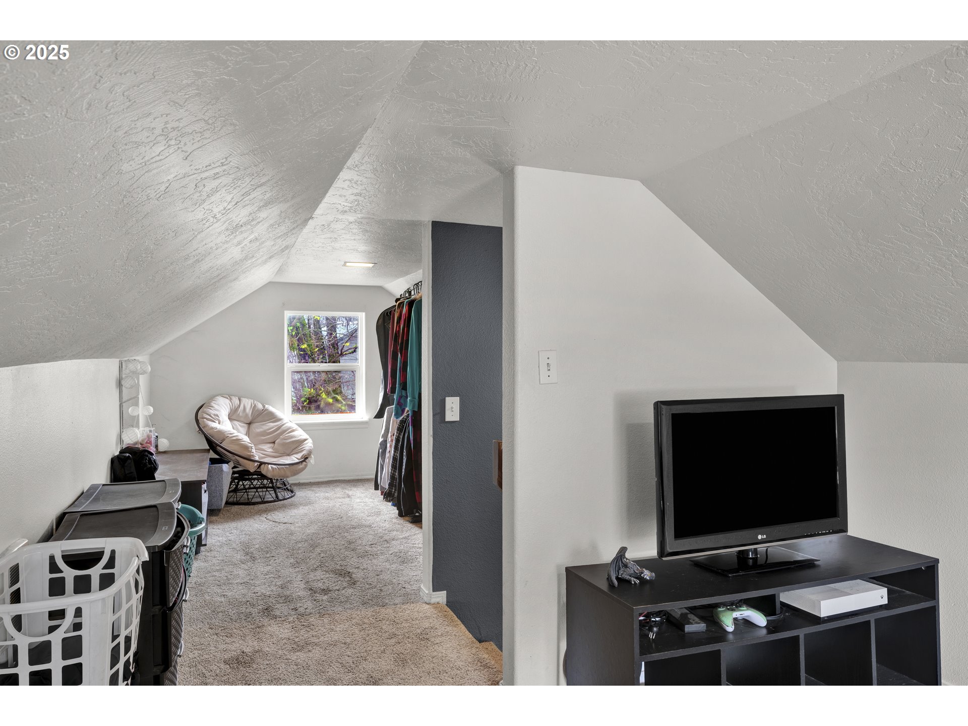 422 Elder Street Drain, OR 97435 - Photo 27 of 41 a living room with furniture and a flat screen tv