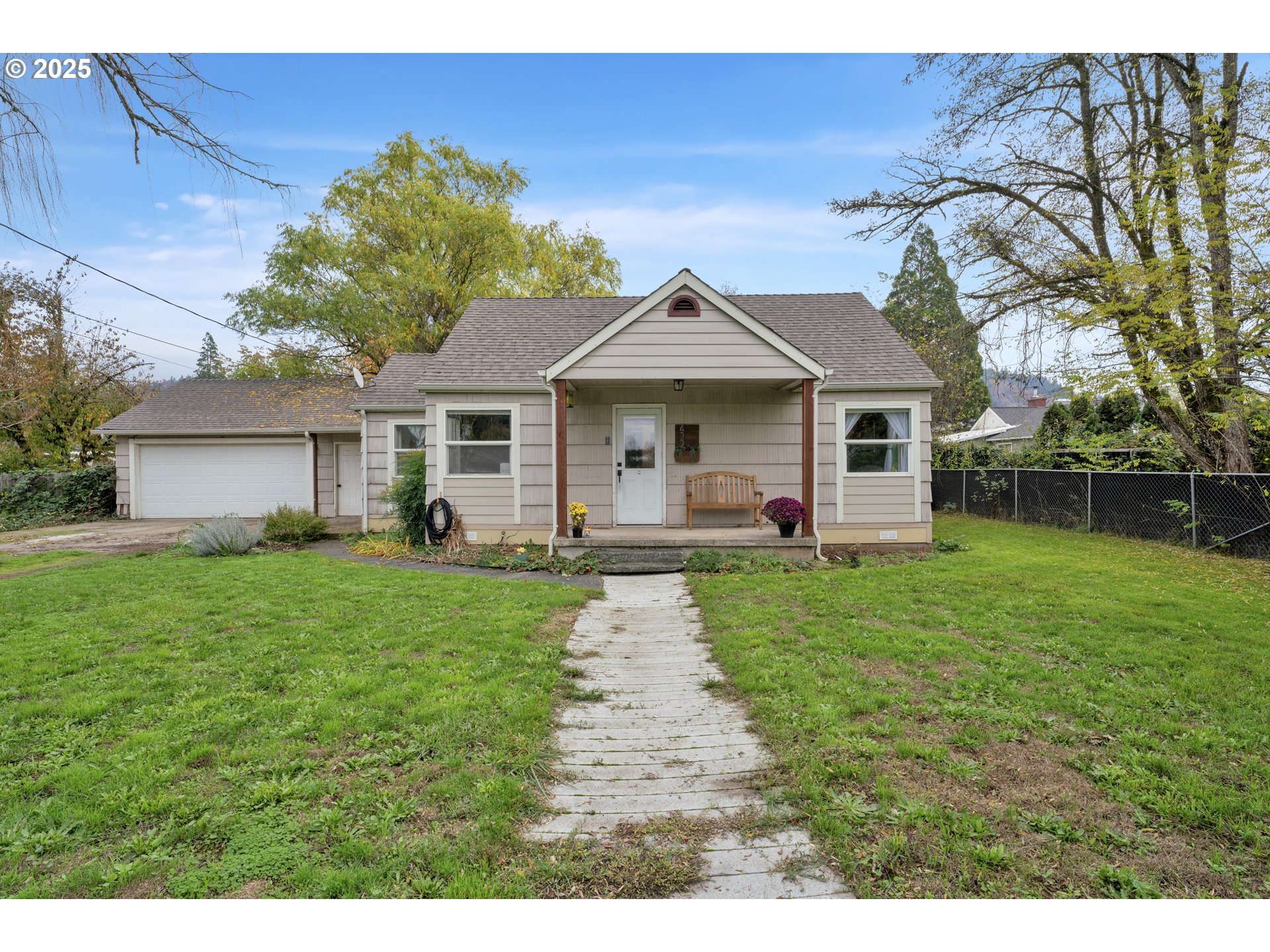 422 Elder Street Drain, OR 97435 - Photo 4 of 41 a front view of a house with a yard and garage