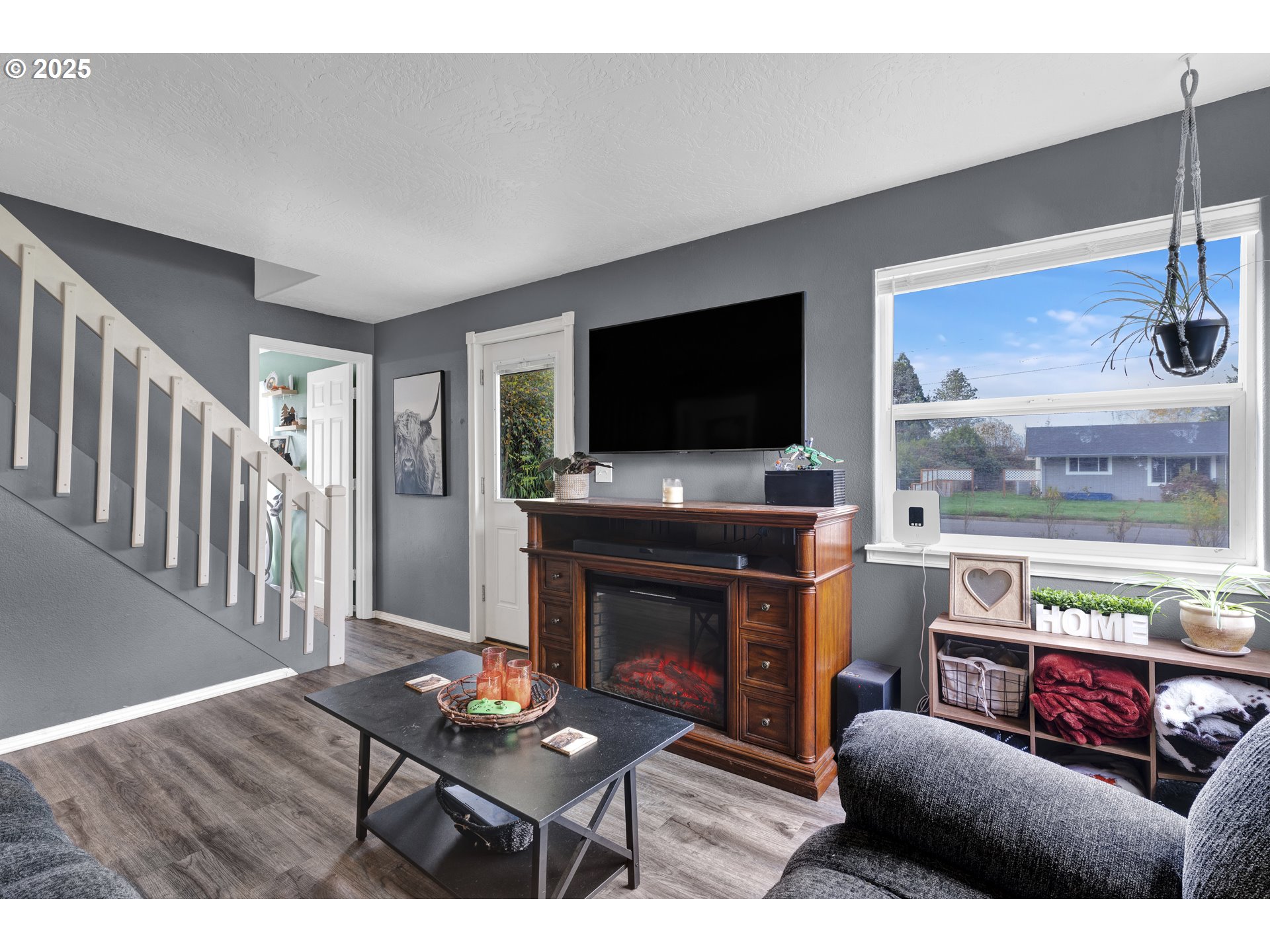 422 Elder Street Drain, OR 97435 - Photo 10 of 41 a living room with furniture and a flat screen tv