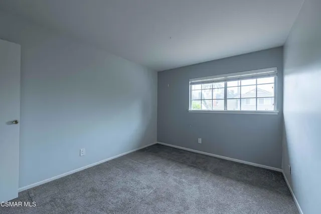 a view of an empty room and closet