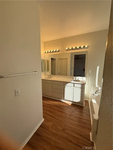 a room with a sink and a refrigerator