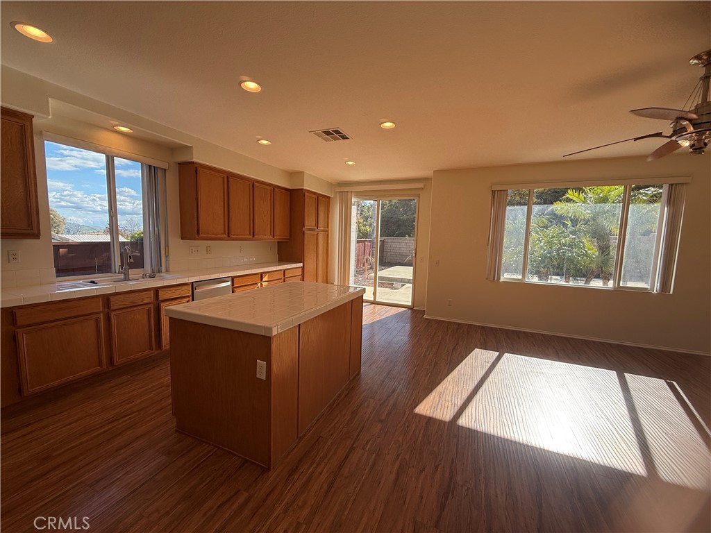 8783 Hunt Canyon Road Corona, CA 92883 - Photo 5 of 24 a kitchen with stainless steel appliances granite countertop a stove a sink and a refrigerator