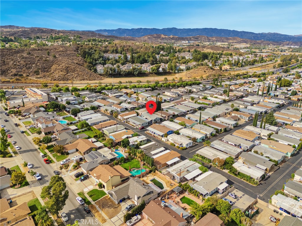 20401 Soledad Canyon Road, Unit 691 Canyon Country, CA 91351 - Photo 20 of 20 an aerial view of residential houses with outdoor space