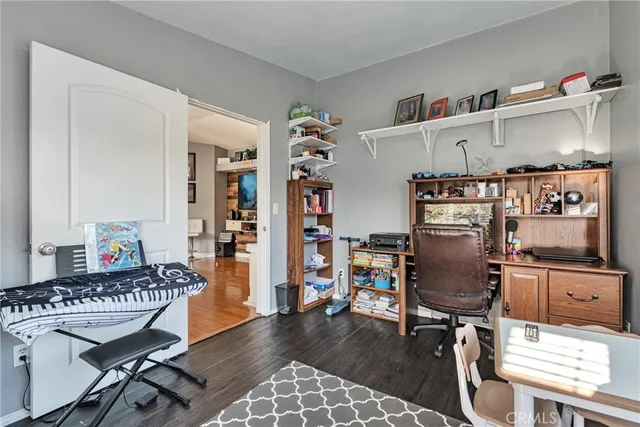 a workspace with furniture and wooden floor