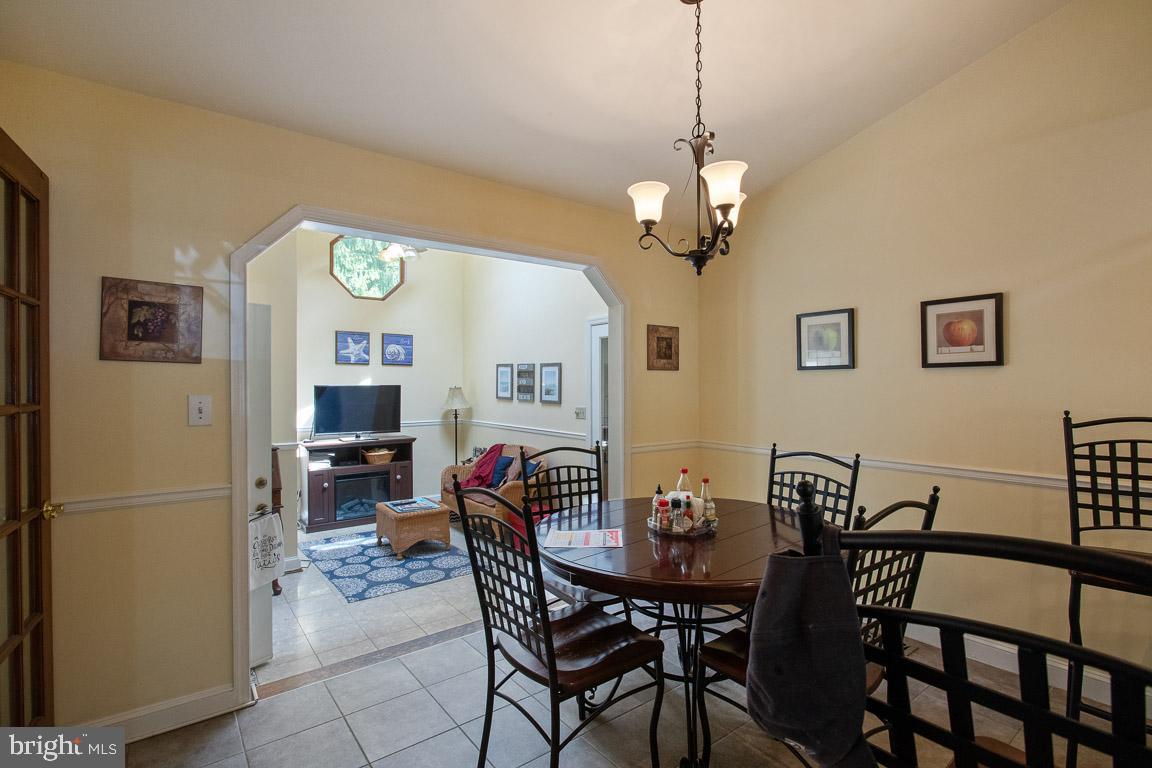 5712 Columbia Road Columbia, MD 21044 - Photo 9 of 26 Dinning Room with a view of the sunroom