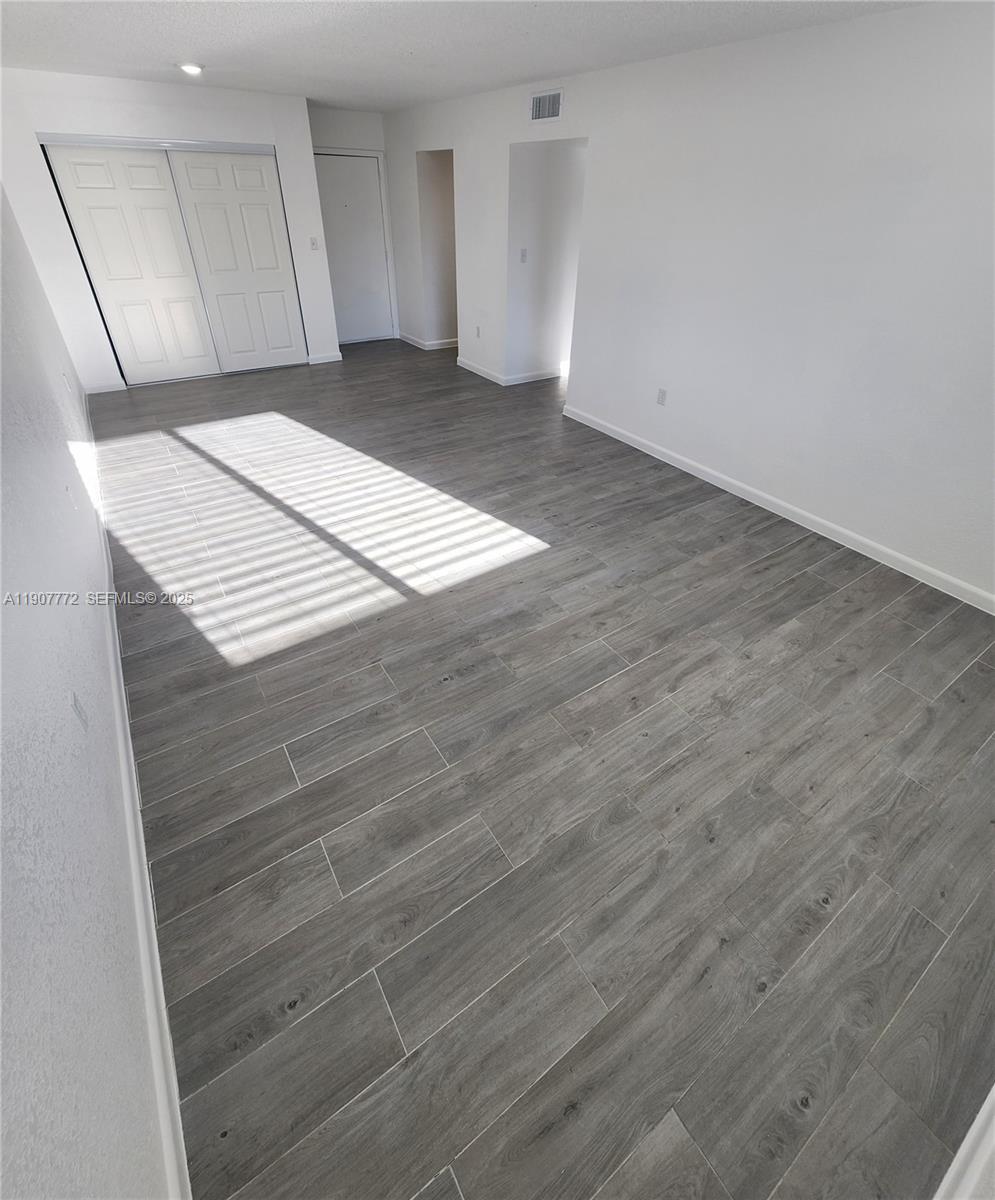 10900 Southwest 196th Street, Unit 213 Cutler Bay, FL 33157 - Photo 7 of 15 a view of an empty room