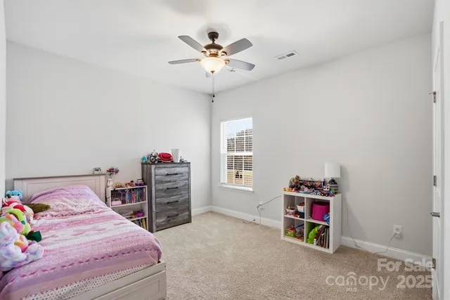 a bedroom with a bed and a closet