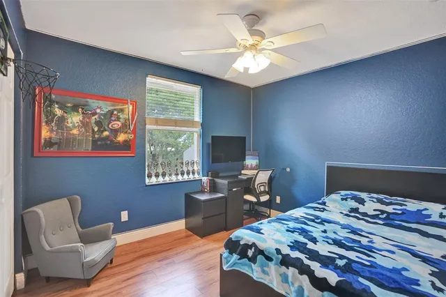 a bedroom with furniture and a window