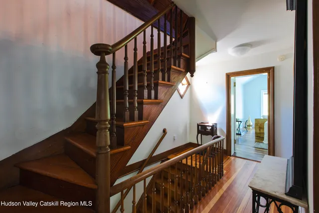 a bathroom with a sink a toilet and a window