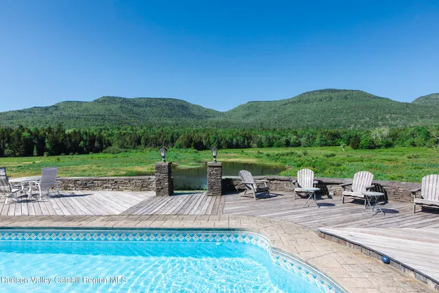 a view of a hallway with paintings on the wall