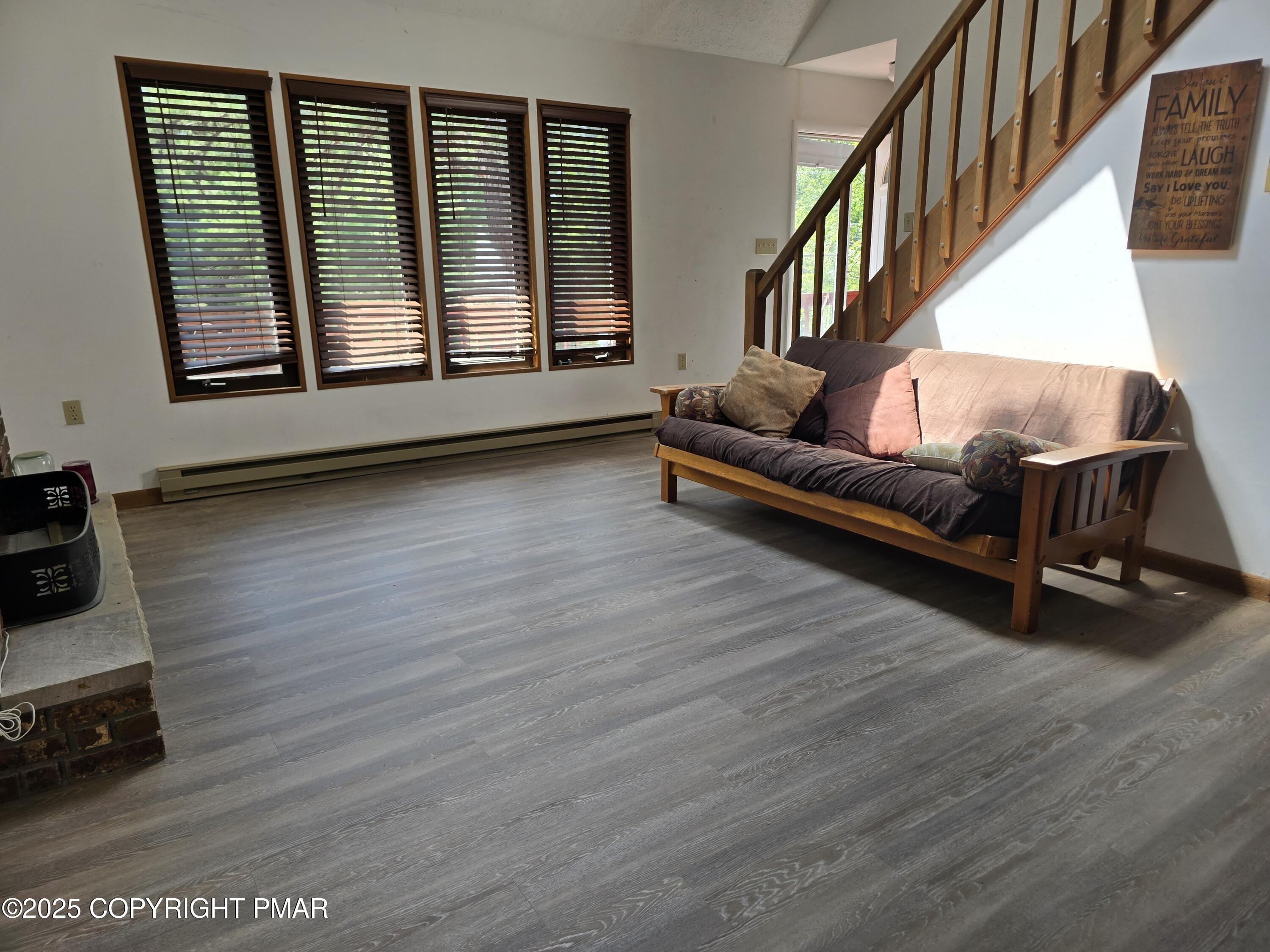 117 Manchester Drive Bushkill, PA 18324 - Photo 11 of 33 a living room with furniture and a window