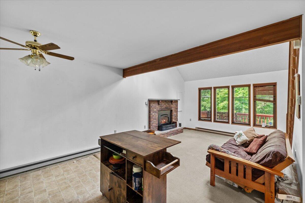 117 Manchester Drive Bushkill, PA 18324 - Photo 18 of 33 a living room with furniture a window and a ceiling fan